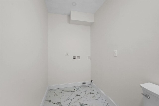 washroom featuring washer hookup, baseboards, laundry area, and marble finish floor