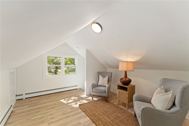 living area featuring baseboard heating, light wood-type flooring, and lofted ceiling