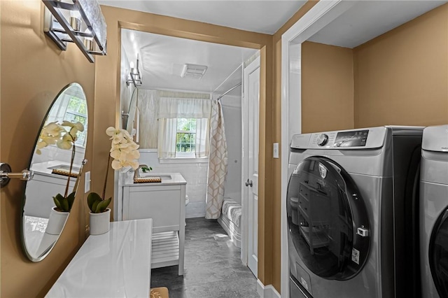 laundry room featuring laundry area and marble finish floor