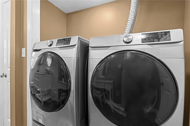laundry area featuring independent washer and dryer
