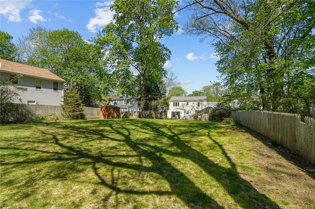 view of yard with a fenced backyard