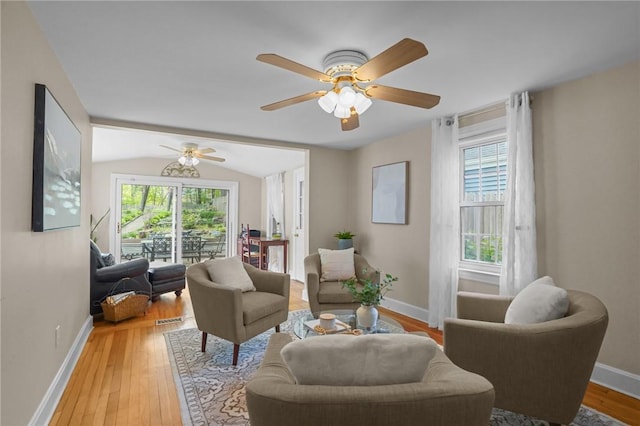 sitting room featuring ceiling fan, plenty of natural light, and light wood finished floors