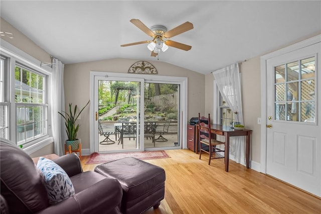 interior space featuring vaulted ceiling, light wood-style floors, a ceiling fan, and a wealth of natural light