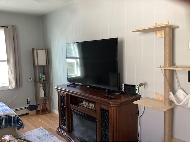 446 Carrington Ave, Woonsocket, RI 02895 - room details featuring a baseboard heating unit and wood finished floors