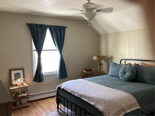 446 Carrington Ave, Woonsocket, RI 02895 - bedroom with a baseboard radiator, lofted ceiling, wood finished floors, and ceiling fan
