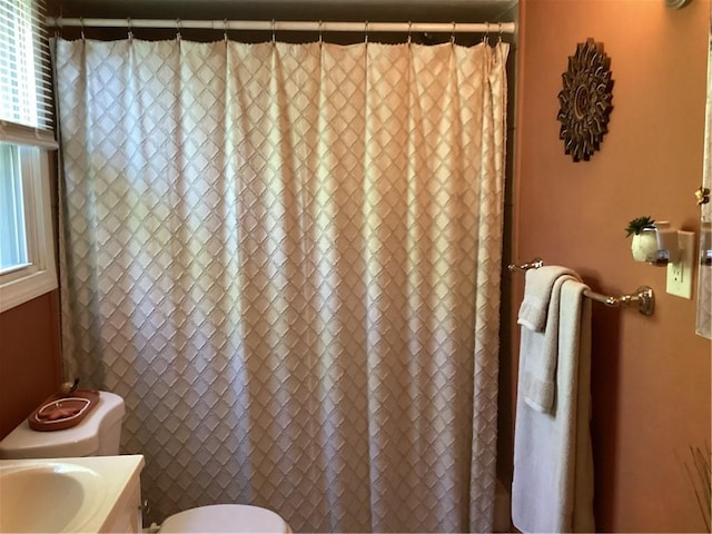 446 Carrington Ave, Woonsocket, RI 02895 - bathroom with vanity, toilet, and a shower with shower curtain