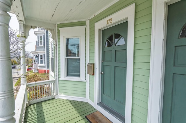 entrance to property featuring a porch