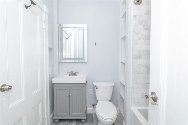 bathroom with vanity, baseboards, bathtub / shower combination, and toilet