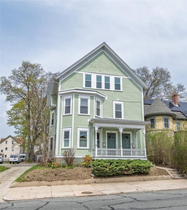 victorian-style house with a porch