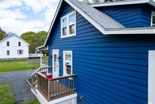 71 Centennial St, Burrillville, RI 02859 - view of side of home with a shingled roof and a yard