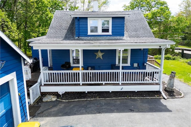 71 Centennial St, Burrillville, RI 02859 - view of front of property featuring a shingled roof and covered porch