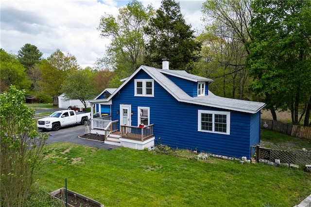 71 Centennial St, Burrillville, RI 02859 - view of front facade featuring a chimney, asphalt driveway, and a porch