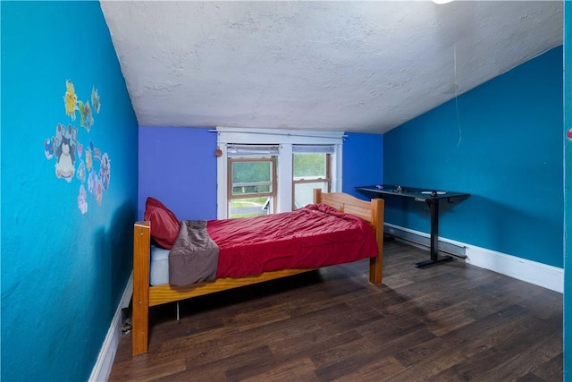 71 Centennial St, Burrillville, RI 02859 - bedroom featuring wood finished floors, vaulted ceiling, baseboards, and a textured ceiling