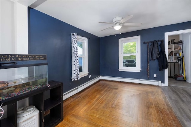 71 Centennial St, Burrillville, RI 02859 - unfurnished bedroom with a baseboard radiator, baseboards, a ceiling fan, and a spacious closet