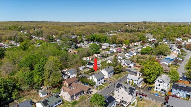 drone / aerial view with a view of trees and a residential view