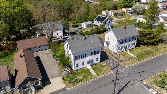 birds eye view of property with a residential view