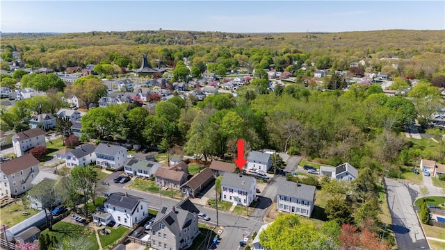 birds eye view of property featuring a residential view and a forest view