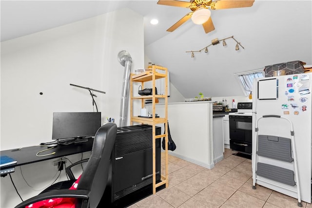 office area with a ceiling fan, light tile patterned flooring, and vaulted ceiling