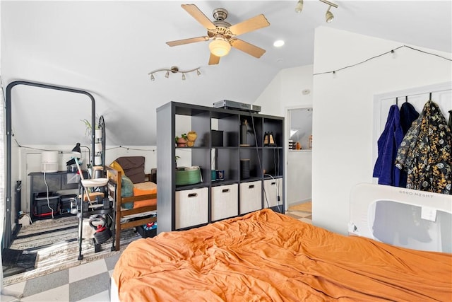 bedroom with rail lighting, a ceiling fan, lofted ceiling, and tile patterned floors