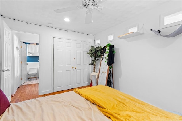bedroom with ceiling fan, a closet, recessed lighting, and wood finished floors
