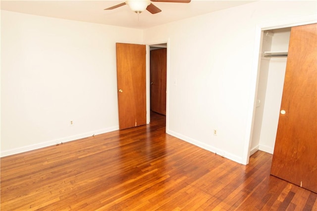 7 Smithfield Dr, Middletown, RI 02842 - unfurnished bedroom featuring baseboards, ceiling fan, a closet, and wood finished floors