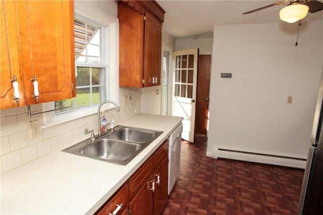 7 Smithfield Dr, Middletown, RI 02842 - kitchen with a ceiling fan, backsplash, a sink, light countertops, and a baseboard radiator