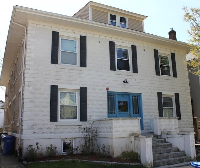 view of front of property with a chimney