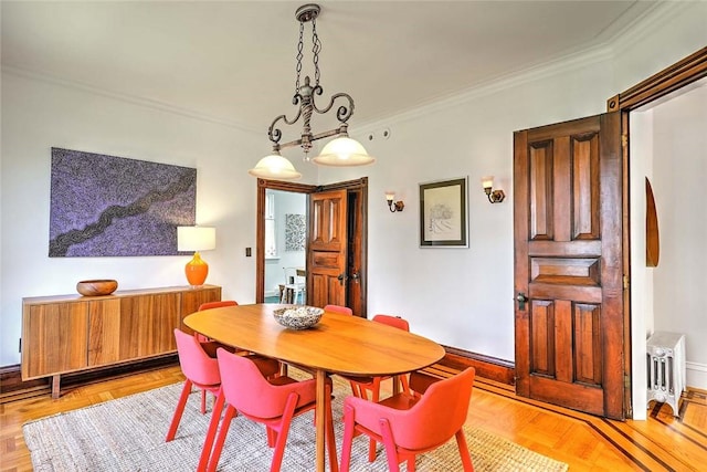dining area with baseboards and ornamental molding