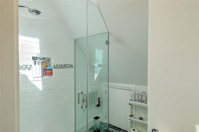 full bath featuring a stall shower and vaulted ceiling