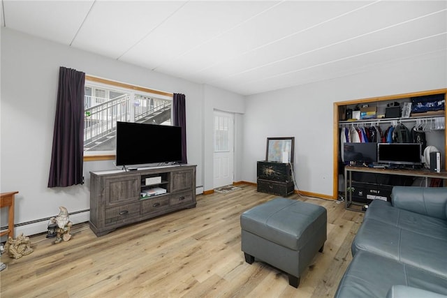 94 Cowesett Ave Unit 1, West Warwick, RI 02893 - living room featuring baseboards, a wealth of natural light, and wood finished floors