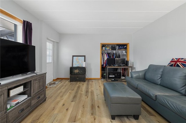 94 Cowesett Ave Unit 1, West Warwick, RI 02893 - living room featuring baseboards and light wood-style floors