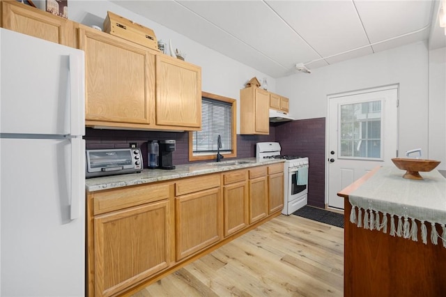 94 Cowesett Ave Unit 1, West Warwick, RI 02893 - kitchen with a sink, light wood-type flooring, white appliances, and a wealth of natural light