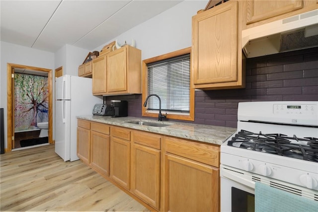94 Cowesett Ave Unit 1, West Warwick, RI 02893 - kitchen with white appliances, under cabinet range hood, decorative backsplash, and a sink