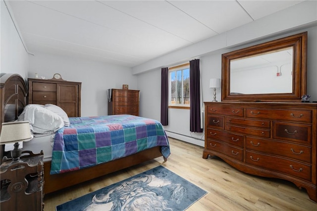 94 Cowesett Ave Unit 1, West Warwick, RI 02893 - bedroom with light wood finished floors, lofted ceiling, and a baseboard heating unit