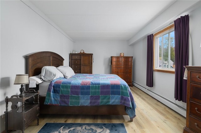 94 Cowesett Ave Unit 1, West Warwick, RI 02893 - bedroom featuring light wood finished floors and baseboard heating