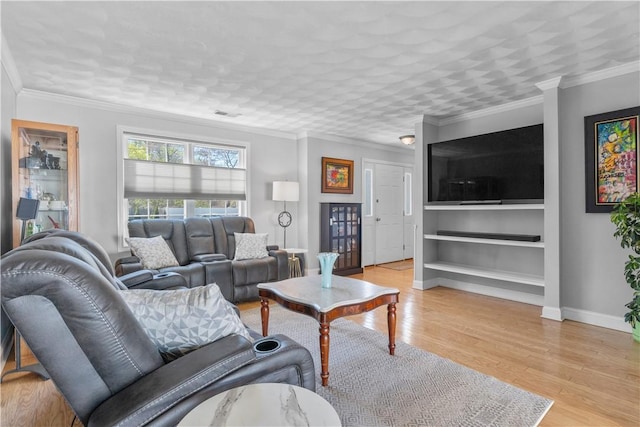 living room featuring ornamental molding and light wood-type flooring
