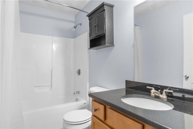 bathroom with vanity, shower / tub combination, and toilet
