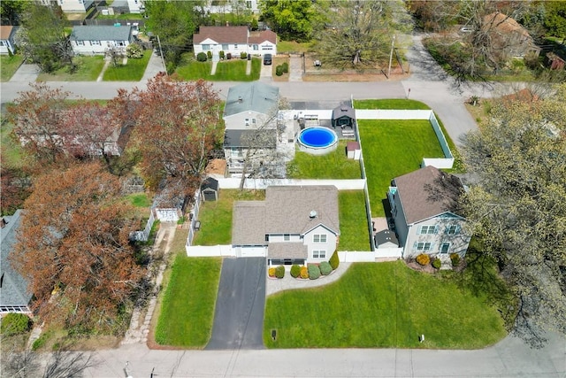 birds eye view of property with a residential view