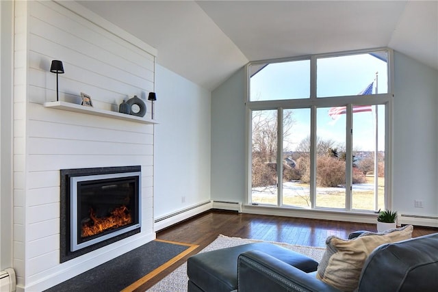 living room with baseboard heating, a glass covered fireplace, vaulted ceiling, and dark wood-style floors