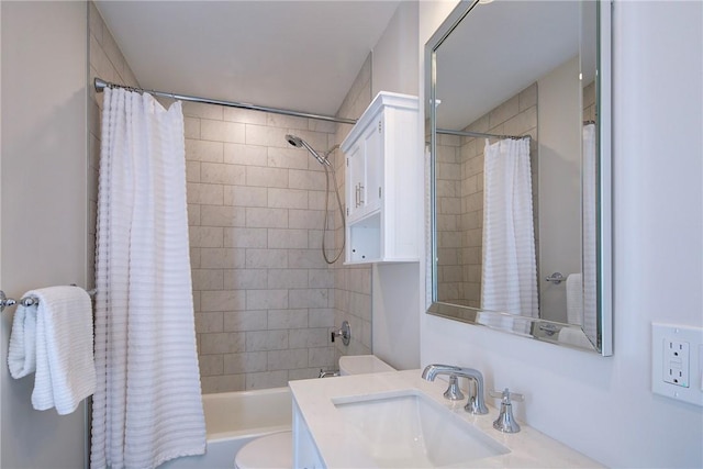 bathroom with vanity, toilet, and shower / tub combo with curtain
