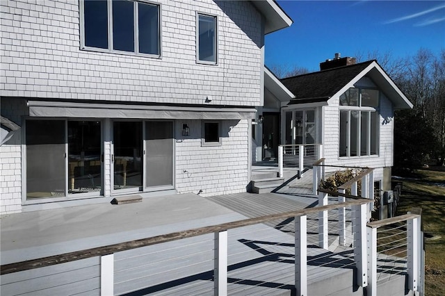 back of house with stairway and a wooden deck
