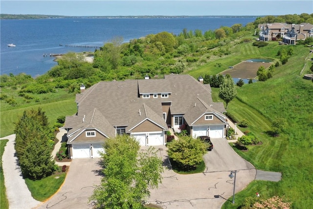 birds eye view of property with a water view