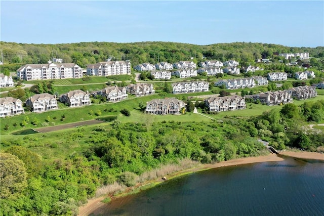 bird's eye view featuring a water view and a forest view