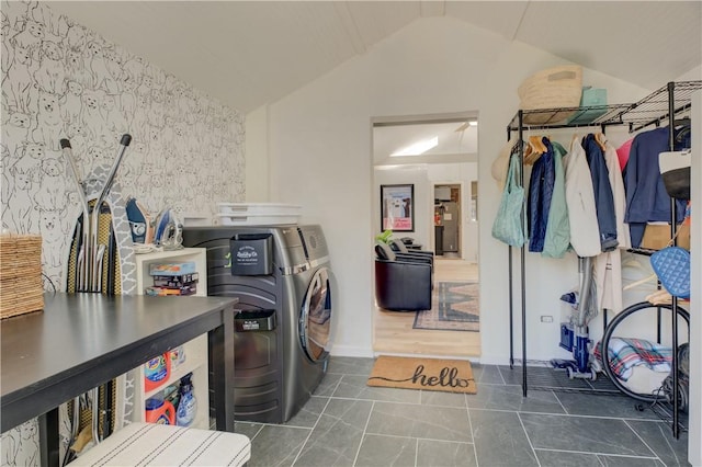 laundry room with laundry area, independent washer and dryer, and tile patterned flooring