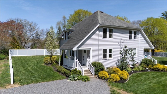 120 Columbia Heights Rd Unit 1, Charlestown, RI 02813 - view of front of property featuring fence, a shingled roof, a porch, and a front yard