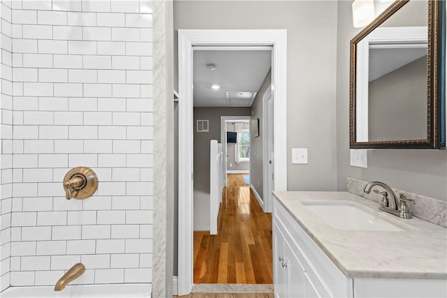 120 Columbia Heights Rd Unit 1, Charlestown, RI 02813 - full bath with vanity, baseboards, wood finished floors, and visible vents