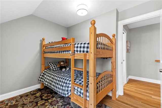 120 Columbia Heights Rd Unit 1, Charlestown, RI 02813 - bedroom featuring baseboards, vaulted ceiling, and wood finished floors