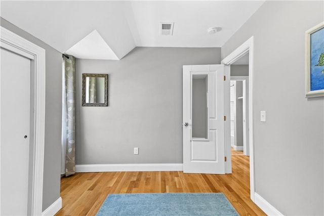 120 Columbia Heights Rd Unit 1, Charlestown, RI 02813 - unfurnished bedroom featuring baseboards, visible vents, and light wood-style flooring