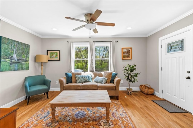 120 Columbia Heights Rd Unit 1, Charlestown, RI 02813 - living room featuring baseboards, ornamental molding, and light wood finished floors