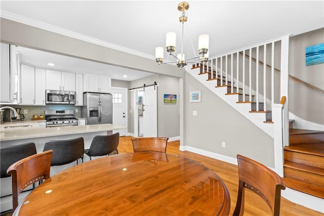 120 Columbia Heights Rd Unit 1, Charlestown, RI 02813 - dining area featuring baseboards, light wood-style floors, stairway, recessed lighting, and a barn door